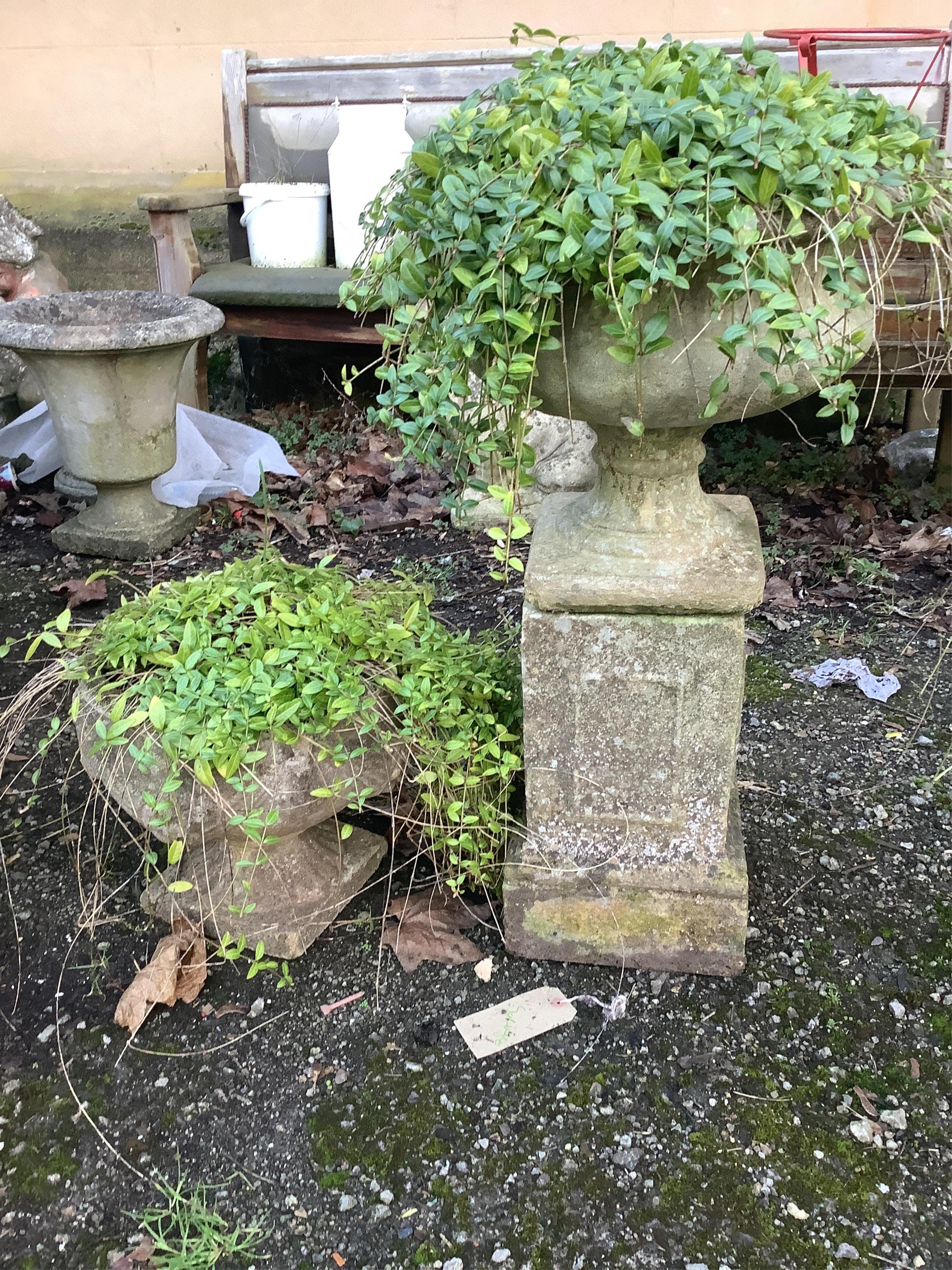 Three reconstituted stone circular garden planters and a square plinth. Condition - fair